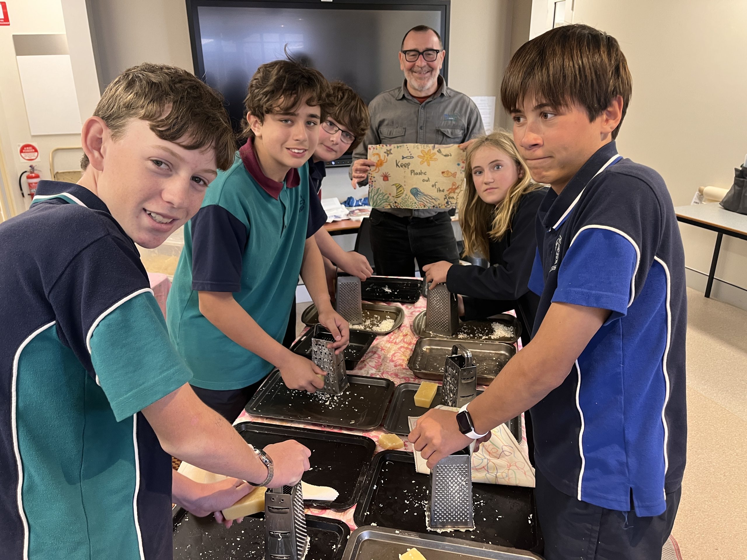 Year 8 making beeswax wraps under the guidance of experts from North East Waste