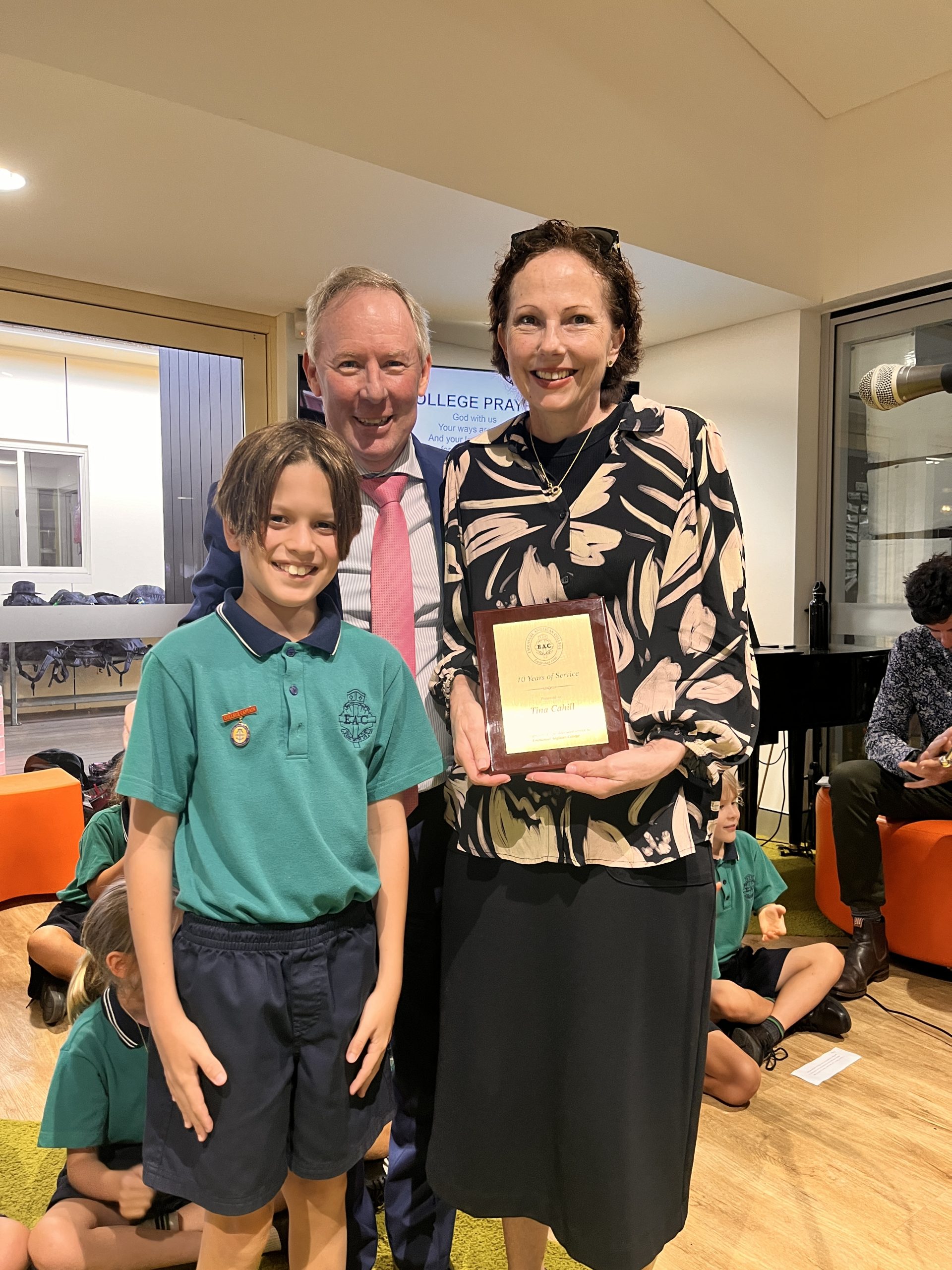 Ms Tina Cahill being presented with her 10 Year Service Award by Primary Captain Will Davis and Principal Mr Robert Tobias
