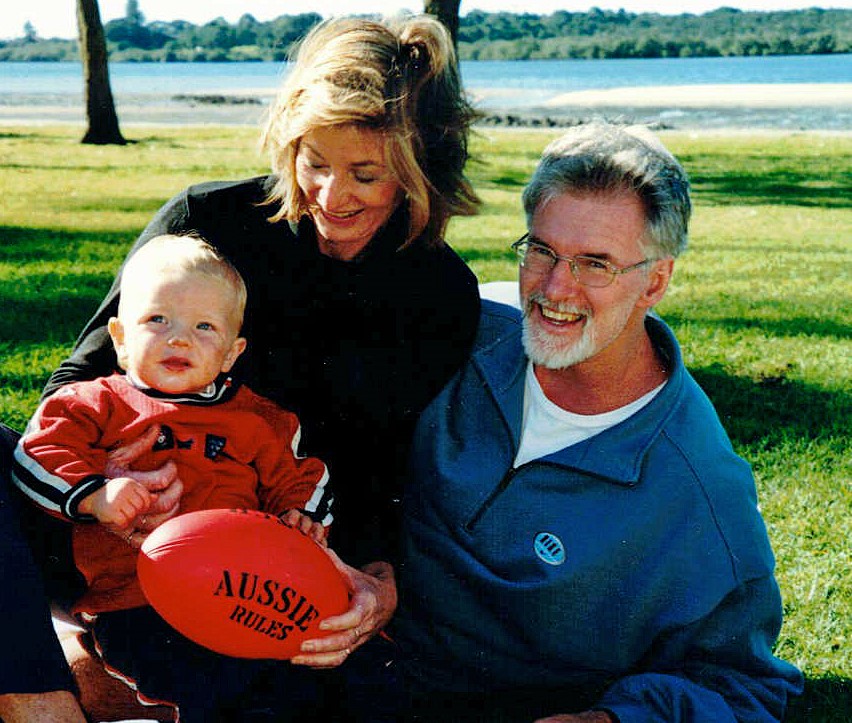 EAC donors, Richard and Lois Hennes photographed with a young Tyler Hobson, now a marathon runner